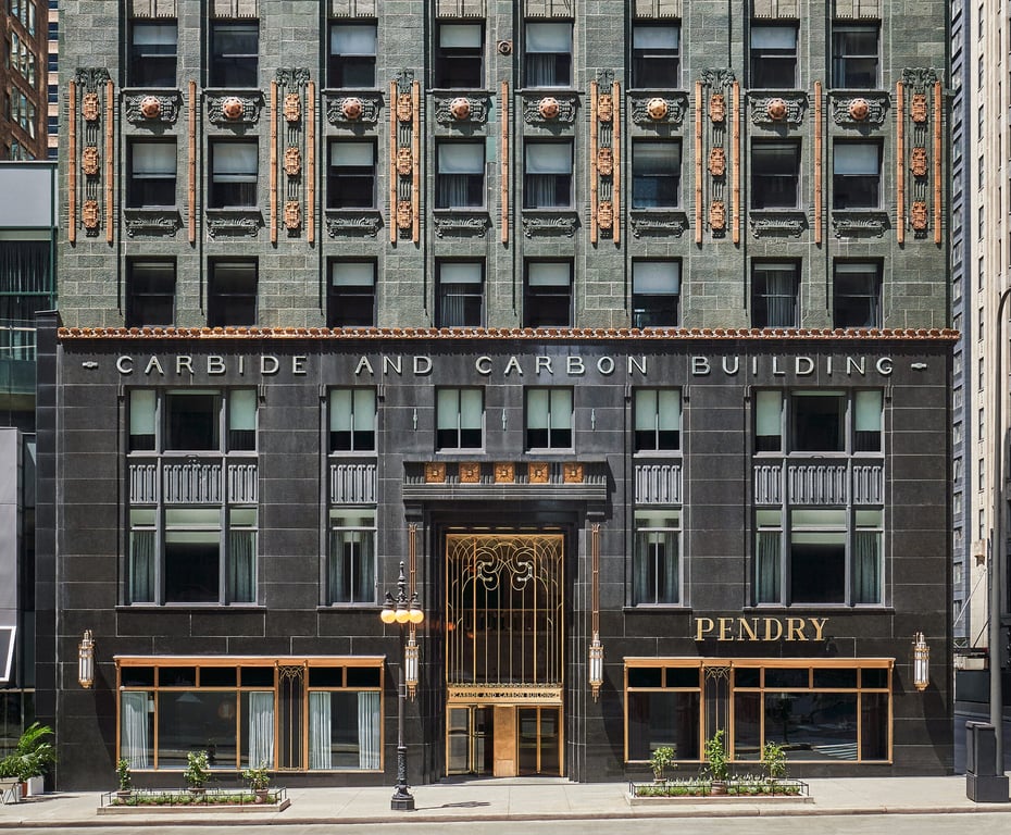 The Pendry Chicago exterior entrance | The Pendry Chicago neighborhood | The Pendry Chicago golden elevators | The Pendry Chicago Belgian marble | The Pendry Chicago lobby seating | The Pendry Chicago monochrome suite design | The Pendry Chicago suite art deco design with bay window | This Modern Luxury Hotel in Downtown Chicago Melds Past and Present With Its Design