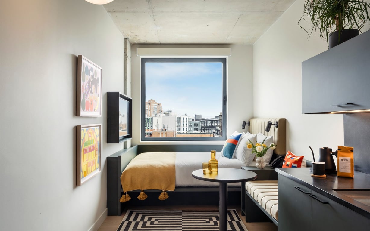 This Art-Focused Boutique Hotel in Brooklyn Sports an Incredible Rooftop | Penny Williamsburg lobby | Penny Williamsburg entrance | Penny Williamsburg suite bedroom | Penny Williamsburg suite kitchen | Penny Williamsburg restaurant | Penny Williamsburg outdoor patio