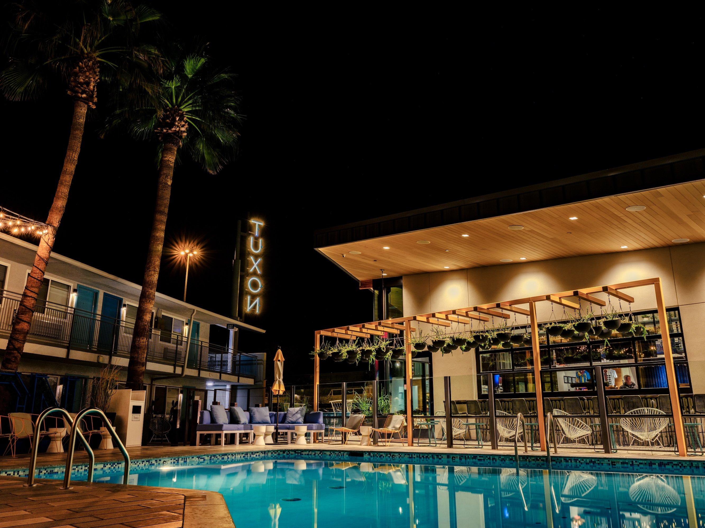 Outdoor pool at The Tuxon in Tuscan, Arizona with Tuxon neon signs seen.