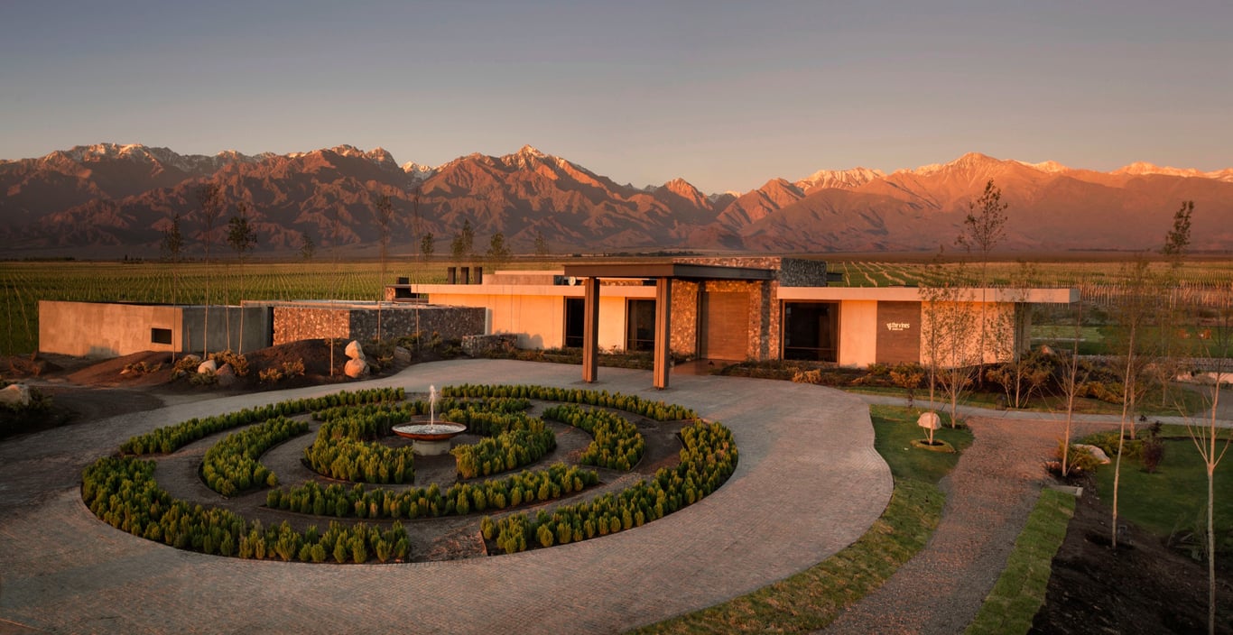 This Resort in Argentina Is the Perfect Vantage Point to Discover South America’s Undiscovered Wine Country | Vines Resort & Spa outdoor pool | Vines Resort & Spa suite bedroom | Vines Resort & Spa suite bathroom | Vines Resort & Spa bar seating | Vines Resort & Spa outdoor seating
