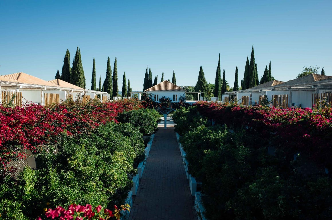 Experience the Pastoral Side of the Algarve at This Idyllic Boutique Hotel | Octant Vila Monte garden | Octant Vila Monte center seating | Octant Vila Monte lobby | Octant Vila Monte exterior | Octant Vila Monte outdoor pool | Octant Vila Monte poolside | Octant Vila Monte bedroom