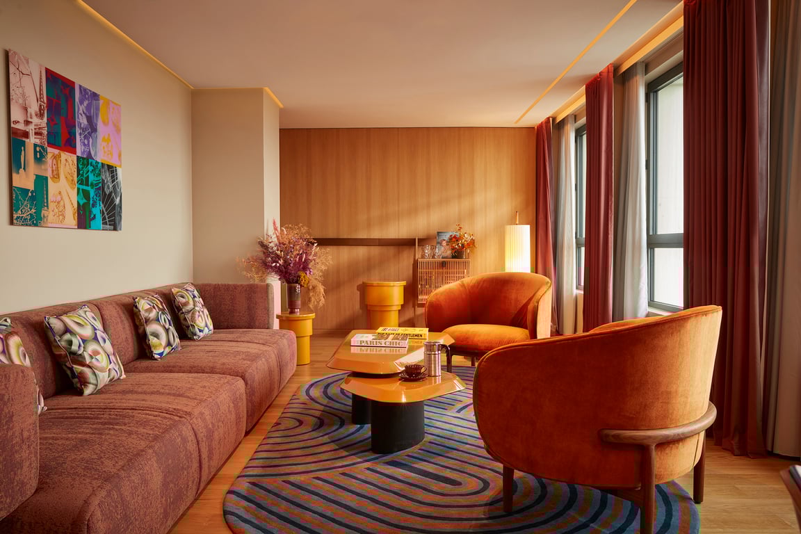 This It-Girl of Paris Hotels Is Perfect for Trendy Travelers | SO/ Paris hotel lobby seating | SO/ Paris hotel check in | SO/ Paris hotel bedroom suite | SO/ Paris hotel bedroom | SO/ Paris hotel clothing | SO/ Paris hotel restaurant dessert | SO/ Paris hotel bedroom | SO/ Paris hotel spa