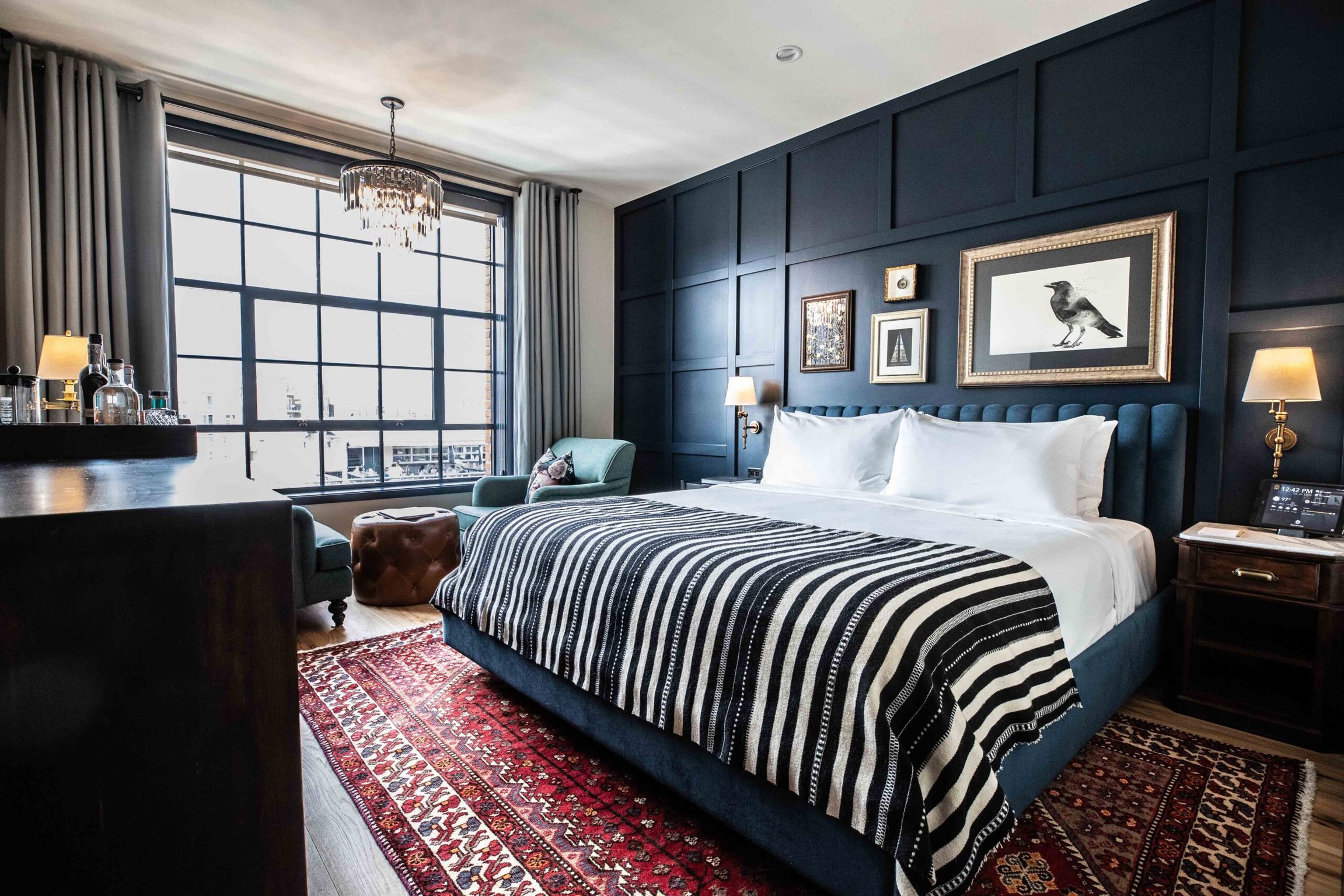 This Boutique Hotel in Denver’s River North Arts District Serves Up Major Cool Factor and Killer Cocktails | The Ramble Hotel exterior | The Ramble Hotel bar seating | The Ramble Hotel bar | The Ramble Hotel outdoor seating | The Ramble Hotel bedroom suite