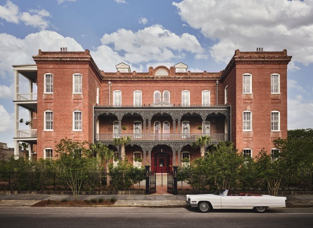 This Design-Forward Hotel in New Orleans May Be the City’s Most Photogenic | Hotel Saint Vincent lobby | Hotel Saint Vincent outdoor pool | Hotel Saint Vincent bar seating | Hotel Saint Vincent bedroom suite