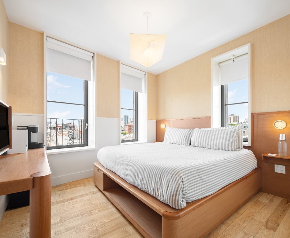 This Urban-Chic Boutique Hotel Is Hidden Down a Cool Graffiti-Lined NYC Alleyway | UNTITLED at 3 Freeman courtyard | UNTITLED at 3 Freeman hallway | UNTITLED at 3 Freeman bedroom suite | UNTITLED at 3 Freeman restaurant | UNTITLED at 3 Freeman rooftop | UNTITLED at 3 Freeman baggage cart