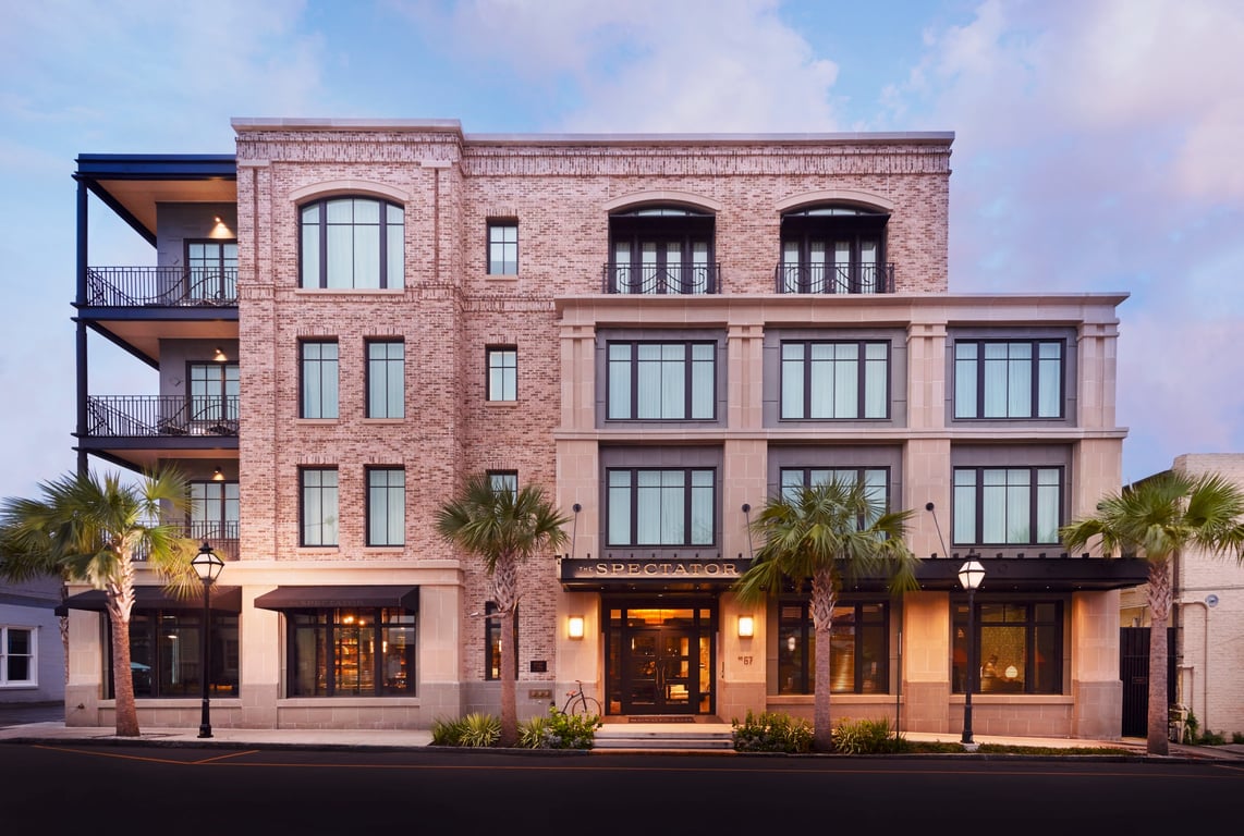 This Well-Heeled Boutique Hotel in Charleston Has a 1920s-Inspired Cocktail Bar and Personalized Butler Service | The Spectator Charleston hotel lobby | The Spectator Charleston hotel hallway | The Spectator Charleston hotel bedroom view | The Spectator Charleston hotel bedroom | The Spectator Charleston hotel bar | The Spectator Charleston rooms service