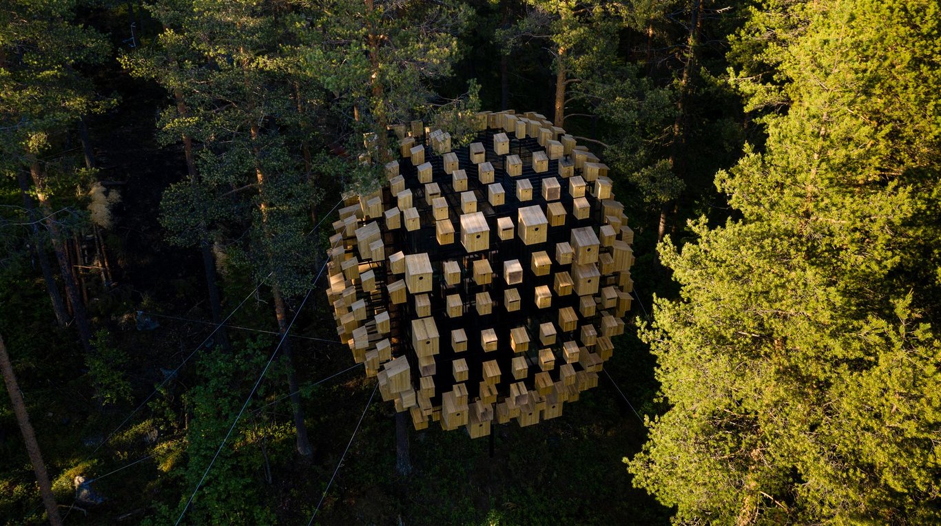 Asleep in the Trees at Treehotel in Swedish Lapland | Treehotel in Sweden suspended cabin | Treehotel in Sweden birdhouse art | Treehotel in Sweden elevated treehouse | Treehotel in Sweden hidden view | Treehotel in Sweden ground view