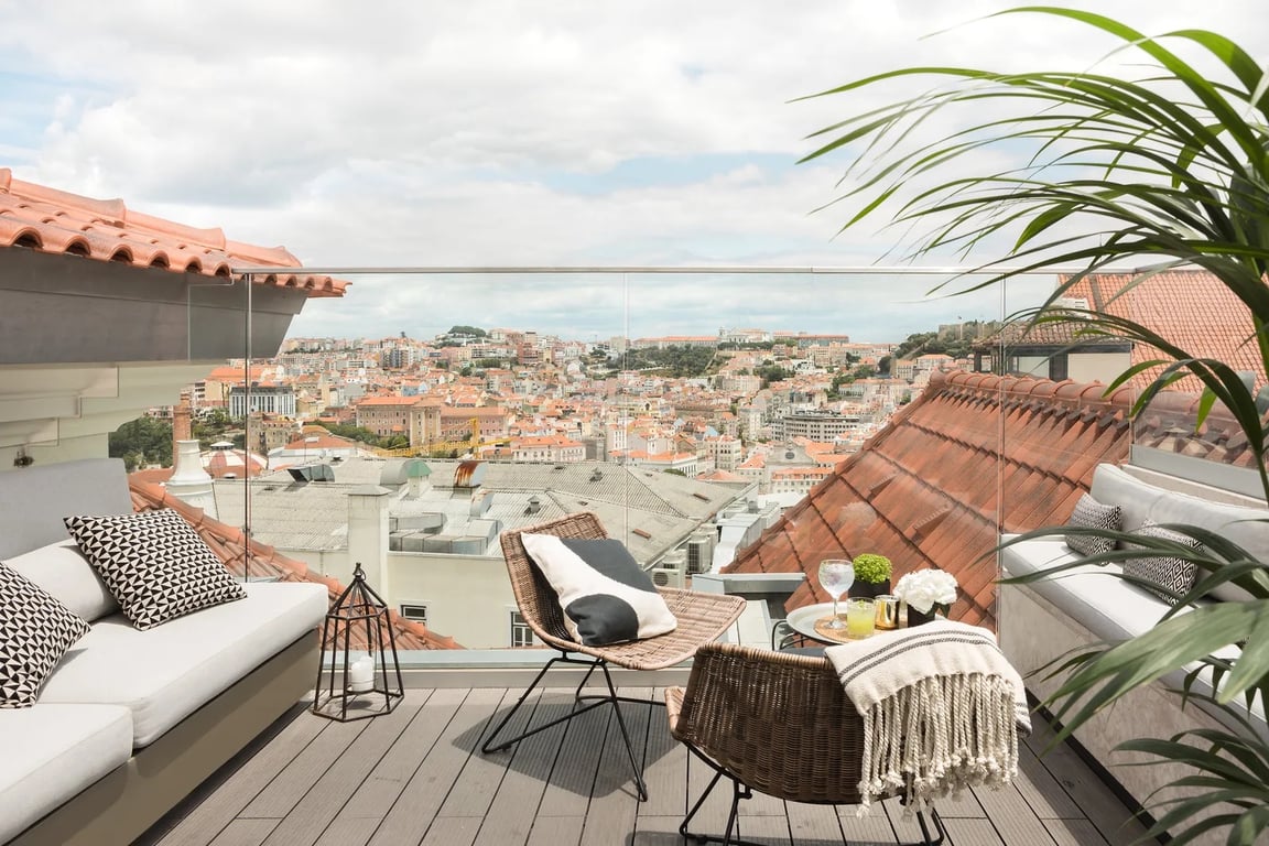 This Apartment-style Hotel Is a Boutique Gem in Lisbon’s Hippest Neighborhood | The Lumiares Hotel & Spa lobby desk | The Lumiares Hotel & Spa bar | The Lumiares Hotel & Spa lobby | The Lumiares Hotel & Spa restaurant | The Lumiares Hotel & Spa bedroom | The Lumiares Hotel & Spa outdoor seating