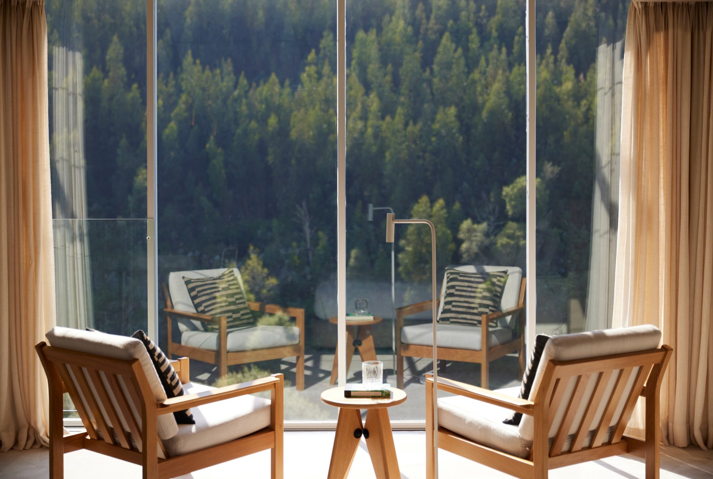 This Minimalist Hotel in Porto Offers Breathtaking Views of The Douro River | Octant Douro Valley pool view | Octant Douro Valley living room | Octant Douro Valley spa | Octant Douro Valley dining | Octant Douro Valley Lovers' Island