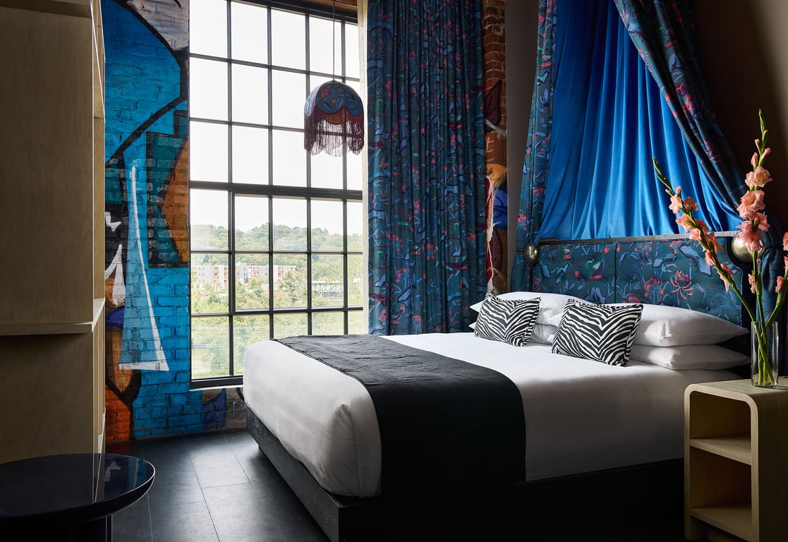This Rad, New Boutique Hotel Channels the Creative Spirit of Asheville’s River Arts District | living room at The Radical in Asheville | Suite at The Radical in Asheville | private desk at The Radical in Asheville | Private bed at The Radical in Asheville | Bathroom at The Radical in Asheville | Double beds at The Radical in Asheville