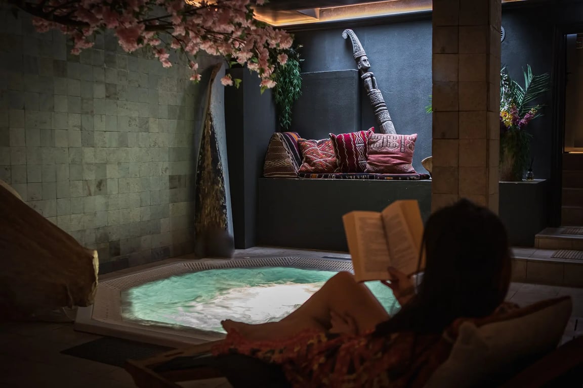 Hygge Meets Balinese Design at This Sustainably-Minded Copenhagen Stay | Axel Guldsmeden hotel exterior | Axel Guldsmeden restaurant seating | Axel Guldsmeden restaurant dining | Axel Guldsmeden bedroom suite | Axel Guldsmeden spa