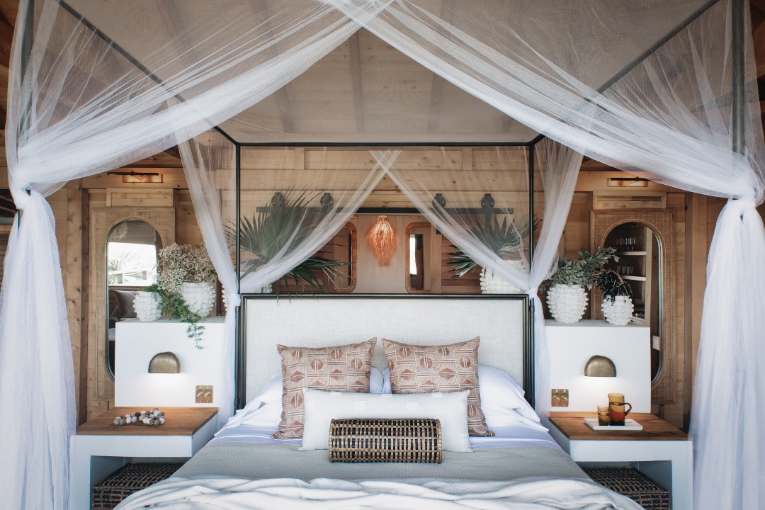 There’s No Passport Required For This Private Island Escape in the U.S. Virgin Islands | Lovango Resort & Beach Club private beach | Lovango Resort & Beach Club bedroom suite | Lovango Resort & Beach Club bedroom seating | Lovango Resort & Beach Club cabana | Lovango Resort & Beach Club suite balcony