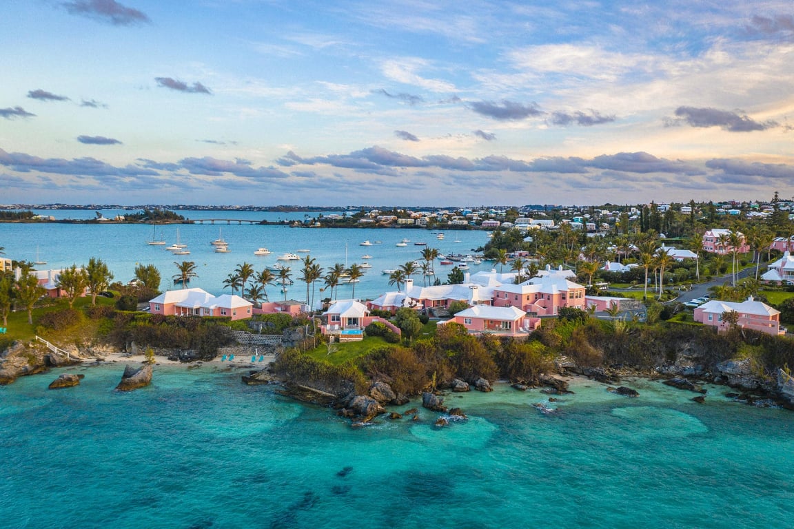 This Bermuda Boutique Hotel Is a Pink Paradise on the Beach | Hotel Review: Cambridge Beaches Resort & Spa suite | Hotel Review: Cambridge Beaches Resort & Spa bedroom | Hotel Review: Cambridge Beaches Resort & Spa outdoor restaurant | Hotel Review: Cambridge Beaches Resort & Spa ocean view