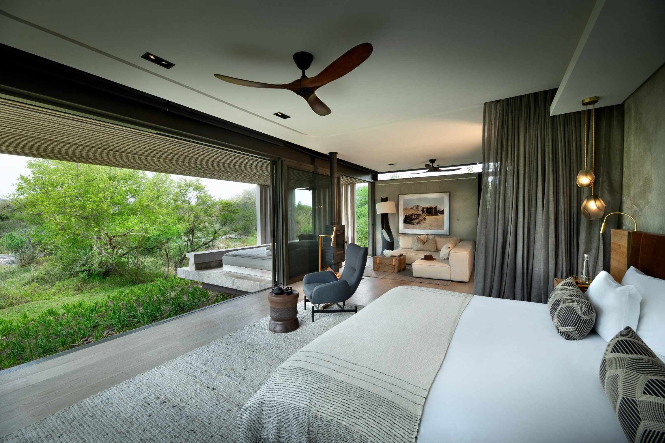 This Is the Most Luxe Safari Spot in South Africa | Cheetah Plains villa view | Cheetah Plains table | Cheetah Plains bedroom suite | Cheetah Plains living room | Cheetah Plains entertainment room