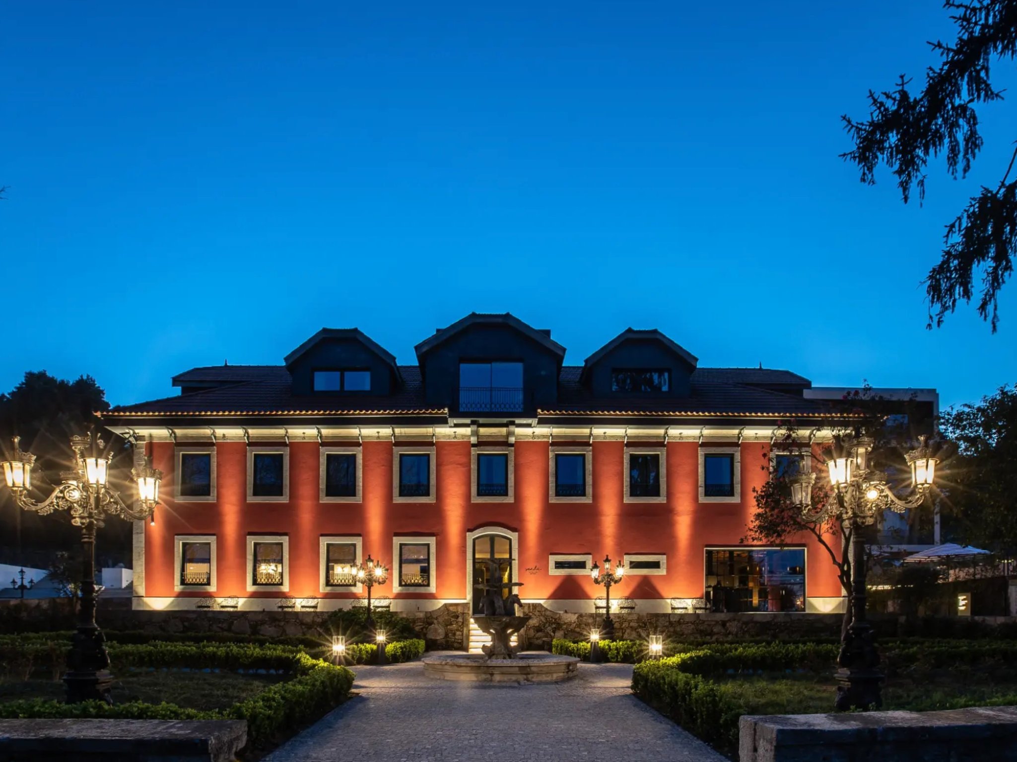 This Boutique Hotel In Porto Is an Ultra Luxurious City Retreat | Vinha Boutique Hotel gourmet dining | Vinha Boutique Hotel bedroom suite | Vinha Boutique Hotel indoor pool | Vinha Boutique Hotel bar seating | Vinha Boutique Hotel boat tours