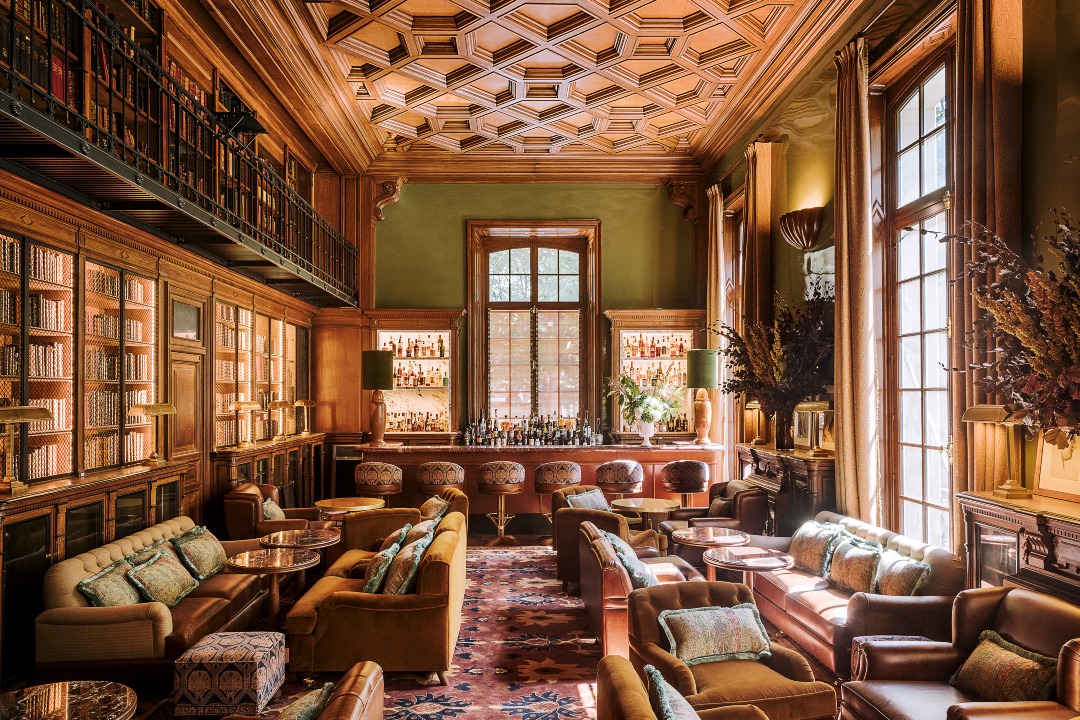 Saint James Paris Is the Getaway of Our Royal Fantasies | Saint James Paris entrance | Saint James Paris lobby | Saint James Paris hotel bedroom suite | Saint James Paris hotel bar | Saint James Paris Library Restaurant | Saint James Paris breakfast restaurant | Saint James Paris restaurant seating | Saint-James-Guerlain-Spa