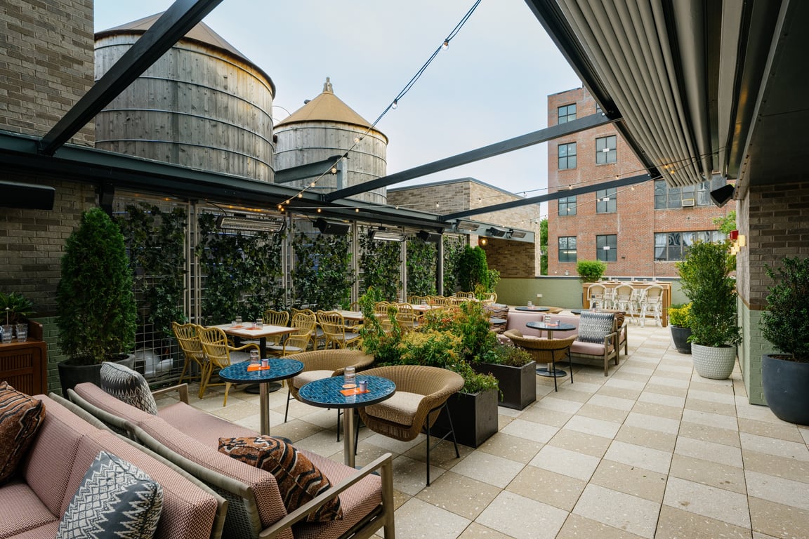 This Williamsburg Restaurant Is the Ultimate Cool Girl Escape | Jaffa Cocktail + Raw Bar rooftop seating | Jaffa Cocktail + Raw Bar sign | Jaffa Cocktail + Raw Bar cuisine | Jaffa Cocktail + Raw Bar signature frozen cocktail | Jaffa Cocktail + Raw Bar oysters
