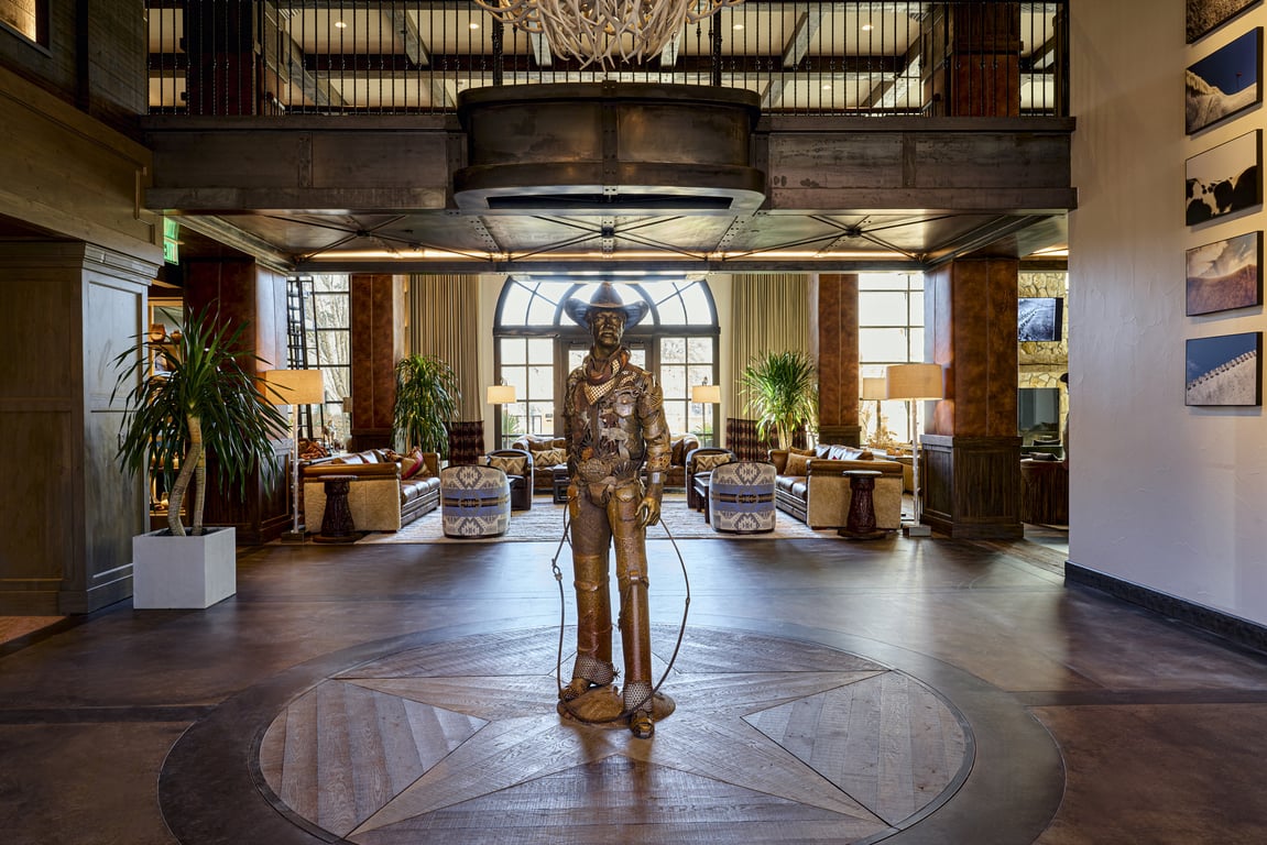 This Western-Inspired Hotel in Fort Worth Balances Cowboy Charm with Touches of Texan Luxury | Fort Worth Leddy boot sign | Welcome to Fort Worth sign | Hotel Drover lobby | Hotel Drover exterior entrance view | Hotel Drover living room | Hotel Drover bedroom | Hotel Drover dining room | Hotel Drover closet