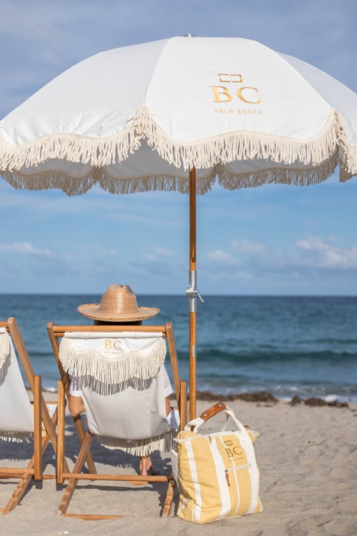 This Palm Beach Boutique Hotel is What Palm Royale Dreams Are Made Of | Brazilian Court Hotel entrance | Brazilian Court Hotel restaurant | Brazilian Court Hotel bedroom | Brazilian Court Hotel lounge chairs by pool | Brazilian Court Hotel spa | Brazilian Court Hotel poolside seating | Brazilian Court Hotel outdoor seating | Brazilian Court Hotel gulf boat ride