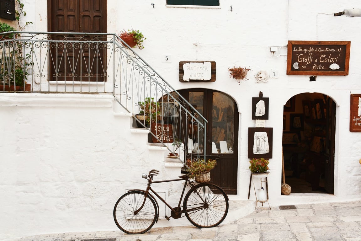 Looking for an Affordable Italian Home? Follow This Instagram Account | My Cheap Italian Home red upholstery | My Cheap Italian Home dinner table | My Cheap Italian Home bathroom with tub