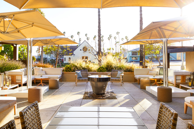 The Ambrose Hotel patio | The Ambrose Hotel lobby | The Ambrose Hotel bedroom suite | The Ambrose Hotel outdoor fireplace | The Ambrose Hotel dining | A Relaxed and Restorative Eco-Chic Hotel in the Heart of Santa Monica