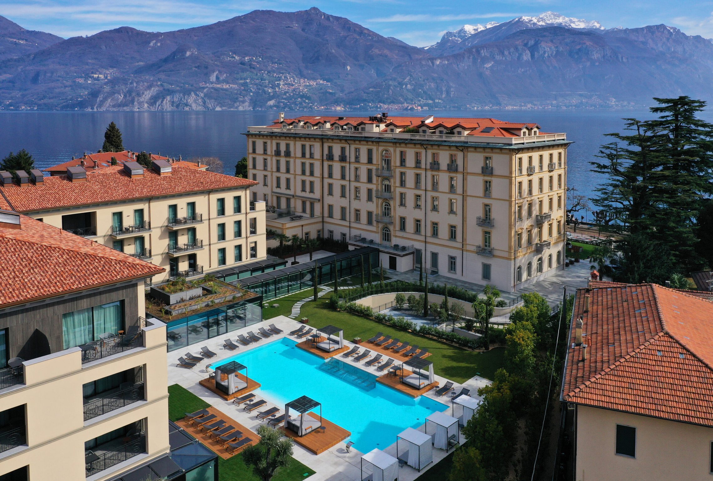 This Luxury Hotel in Lake Como Just Might Be the Area’s Best Stay | Grand Hotel Victoria exterior | Grand Hotel Victoria lobby | Grand Hotel Victoria bedroom suite | Grand Hotel Victoria outdoor pool | Grand Hotel Victoria indoor pool | Grand Hotel Victoria suite living room