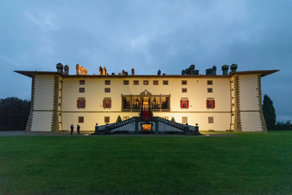 This Storied Tuscan Villa Is Now a Luxurious Boutique Hotel | Tenuta Di Artimino entrance | Tenuta Di Artimino bedroom | Tenuta Di Artimino wine barrels | Tenuta Di Artimino outdoor pool | Tenuta Di Artimino exterior