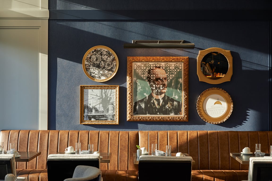 This Charming Boutique Hotel in Boston Is Housed in a Historic Landmark | The Whitney Hotel Boston exterior | The Whitney Hotel Boston courtyard | The Whitney Hotel Boston lobby | The Whitney Hotel Boston bedroom | The Whitney Hotel Boston dining | The Whitney Hotel Boston black dog