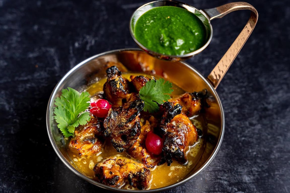 This NYC Restaurant Offers Elevated Variations of Indian Street and Comfort Foods | Kebab aur Sharab chili | Kebab aur Sharab kebab | Kebab aur Sharab iced cocktail | Kebab aur Sharab dinner spread | Kebab aur Sharab signature cocktails