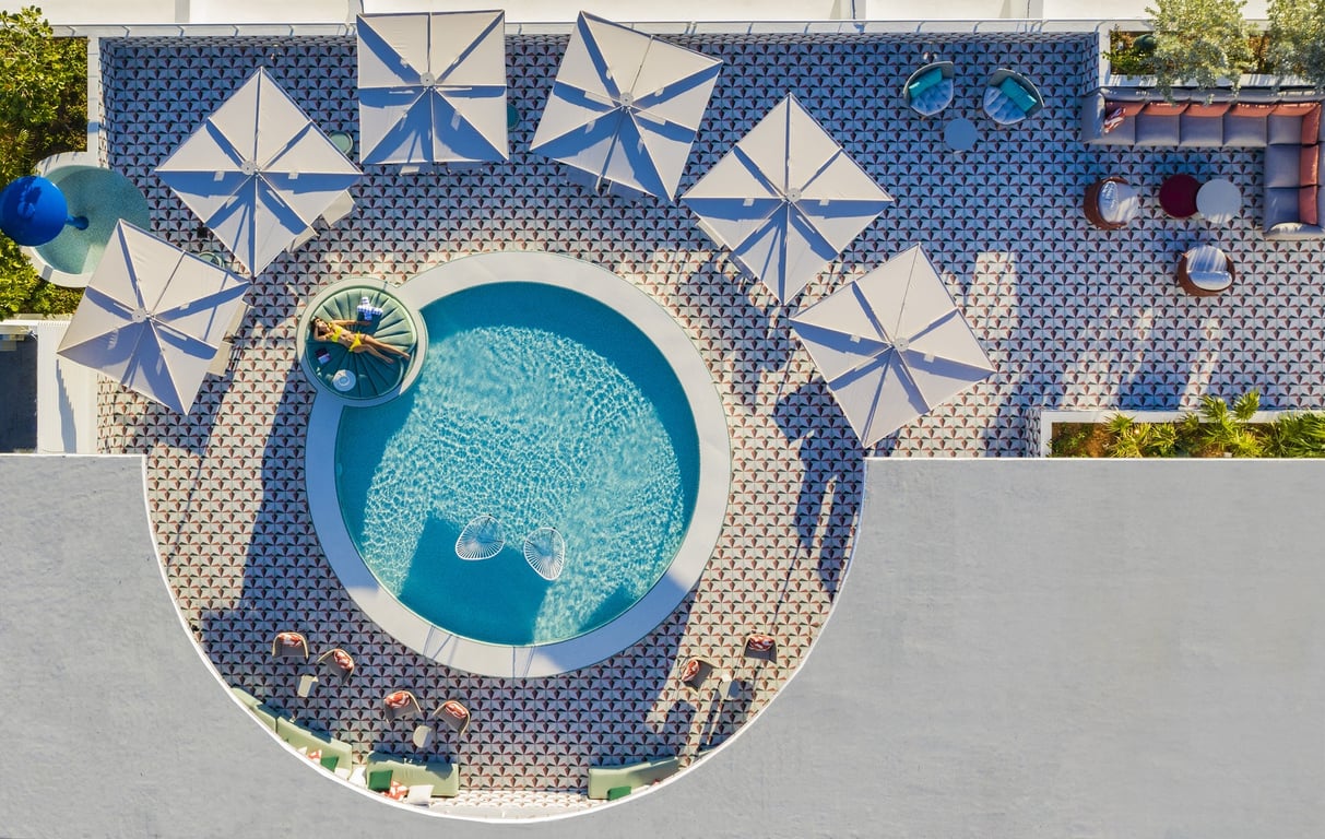 This Boutique Hotel Is Ideally Located in Miami’s Art Deco Historic District | Moxy South Beach outdoor pool | Moxy South Beach rooftop lounge | Moxy South Beach lounge | Moxy South Beach outdoor seating | Moxy South Beach bedroom | Moxy South Beach outdoor pool