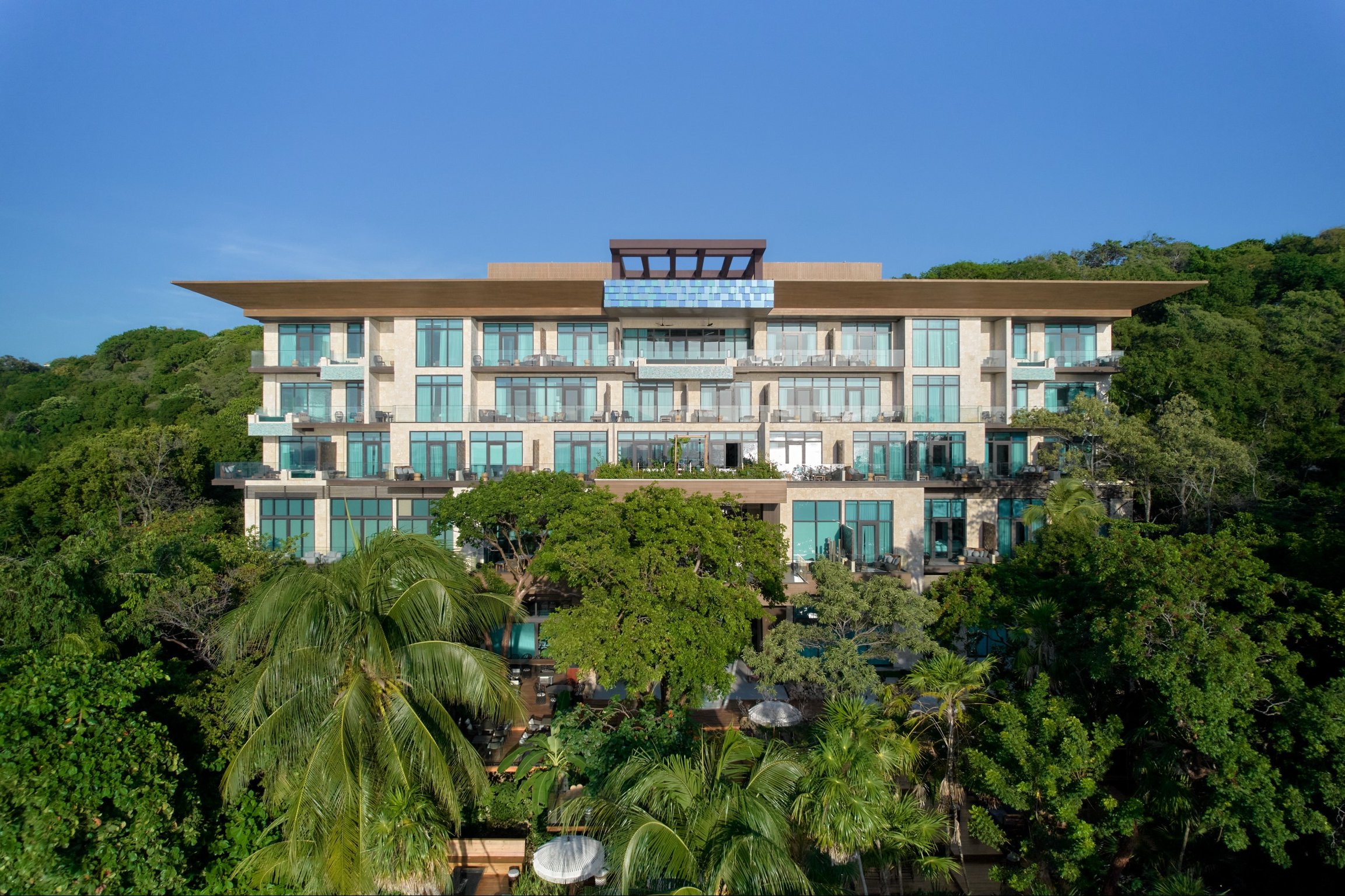 Kimpton Grand Roatán Resort & Spa exterior | Kimpton Grand Roatán Resort & Spa lobby | Kimpton Grand Roatán Resort & Spa bedroom suite | Kimpton Grand Roatán Resort & Spa outdoor pool | Kimpton Grand Roatán Resort & Spa outdoor pool seating | Kimpton Grand Roatán Resort & Spa pool
