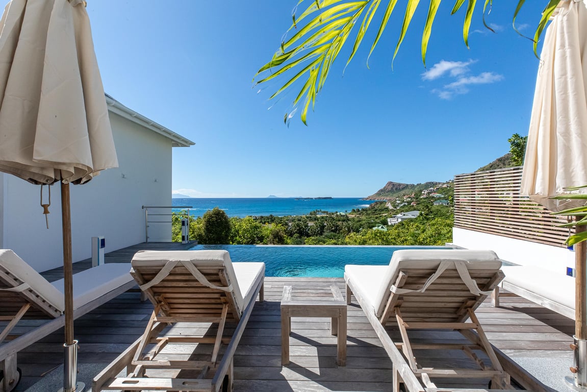 Hotel Review: Hotel Le Toiny (St. Barths) | Hotel Le Toiny entrance | Hotel Le Toiny living room | Hotel Le Toiny suite | Hotel Le Toiny beach club seating