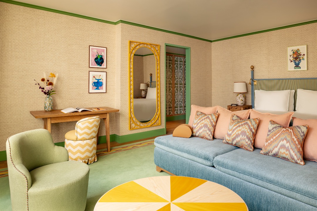 A Fantastical Stay and Secret Garden Await at This Boutique Hotel in Paris | La Fantaisie Paris suite seating and decor | La Fantaisie Paris golden poppy interior | La Fantaisie Paris junior suite with terrace | La Fantaisie Paris bar | La Fantaisie Paris la Cafe | La Fantaisie Paris spa