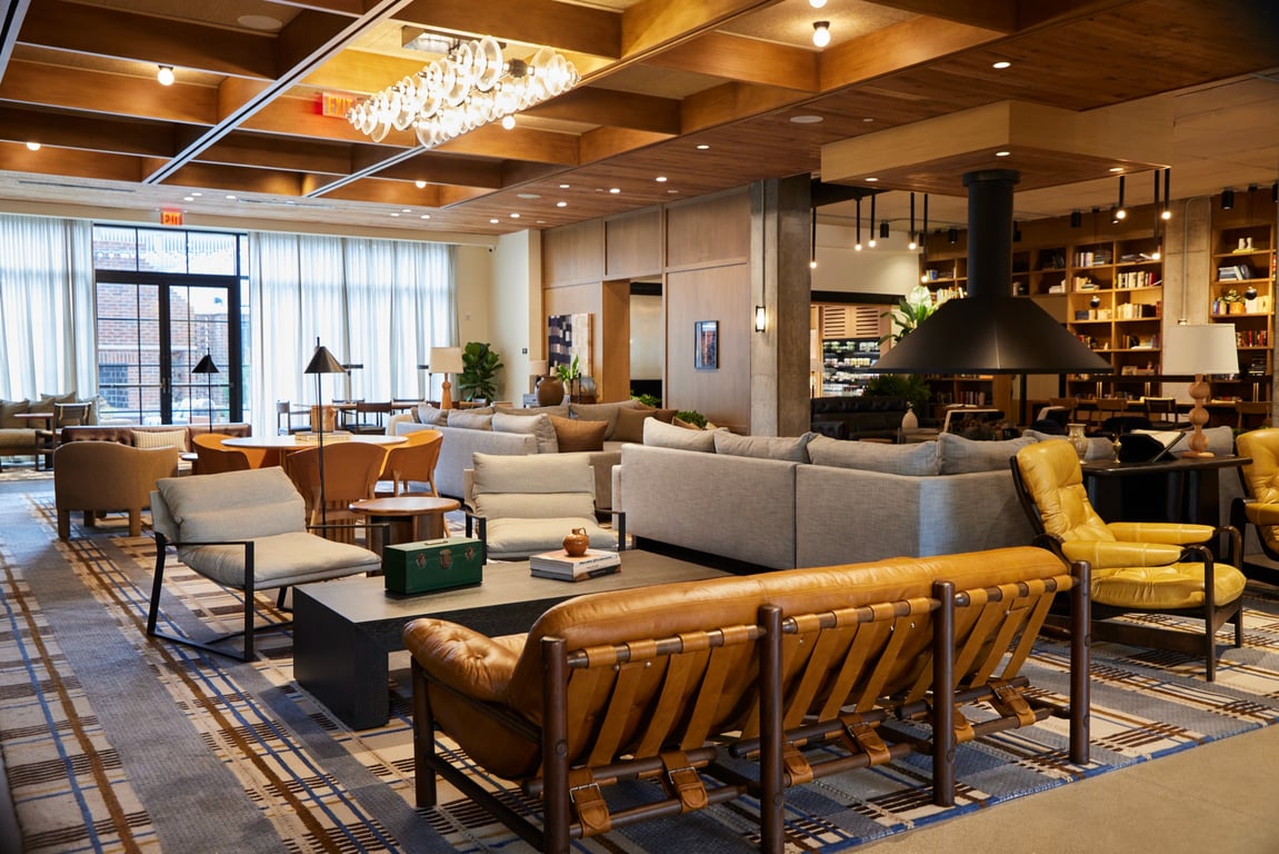 This Boutique Hotel in Columbus, Ohio’s Arts District Invites Guests to “Come Together” | The Junto exterior | The Junto seating | The Junto study | The Junto bedroom | The Junto cafe | The Junto bar lounge | The Junto outdoor patio