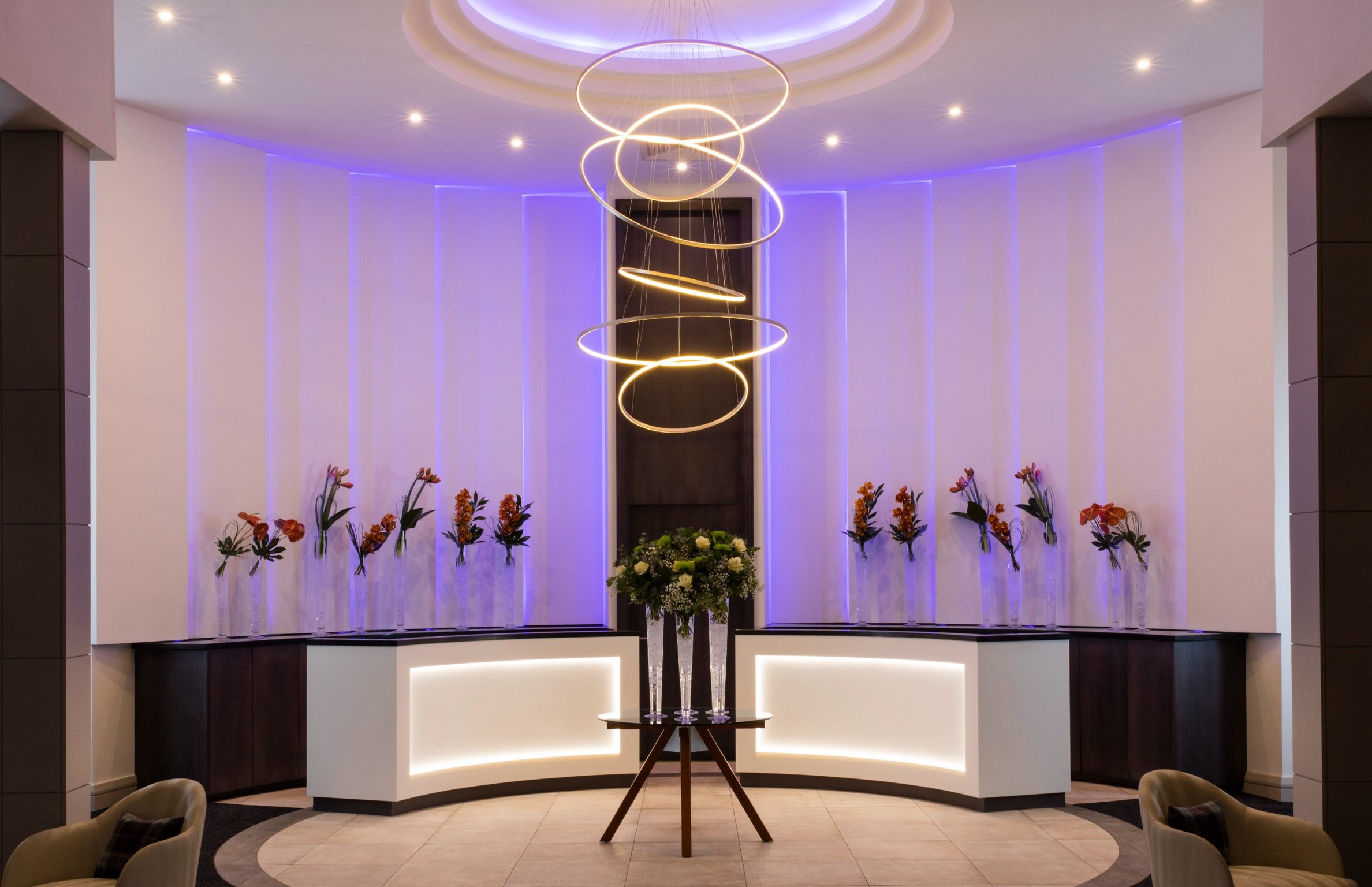 Cozy Up with 160+ Whiskies Around an Indoor Fire Pit at This Boutique Edinburgh Hotel | The Glasshouse Hotel exterior | The Glasshouse Hotel entrance | The Glasshouse Hotel restaurant | The Glasshouse Hotel bedroom suite | The Glasshouse Hotel tasting hall | The Glasshouse Hotel yard