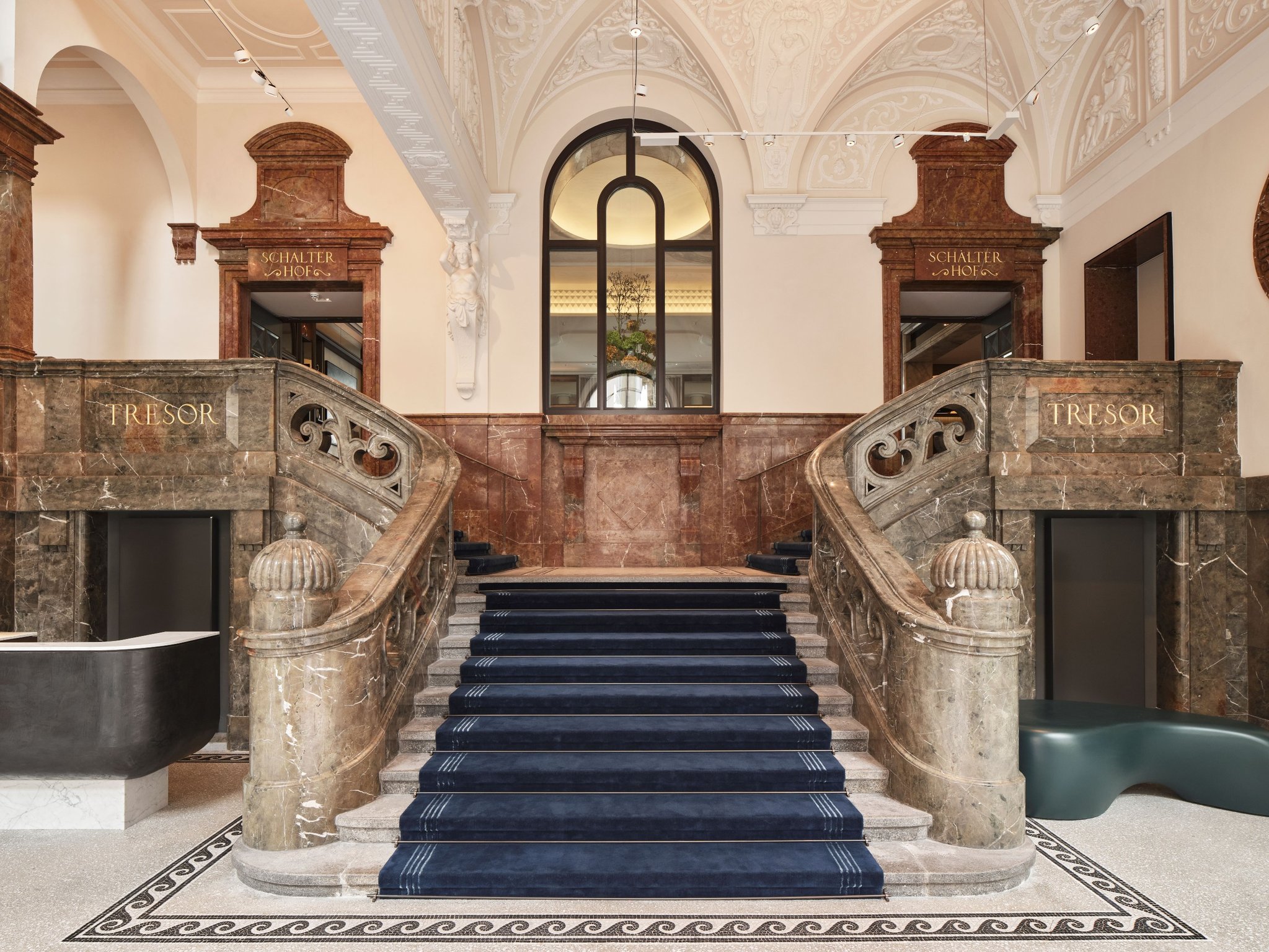 This Luxury Hotel in Munich’s Old Town Is Housed In Two Iconic Historic Buildings | Rosewood Munich staircase | Rosewood Munich lobby | Rosewood Munich bedroom | Rosewood Munich seating | Rosewood Munich restaurant seating | Rosewood Munich indoor pool