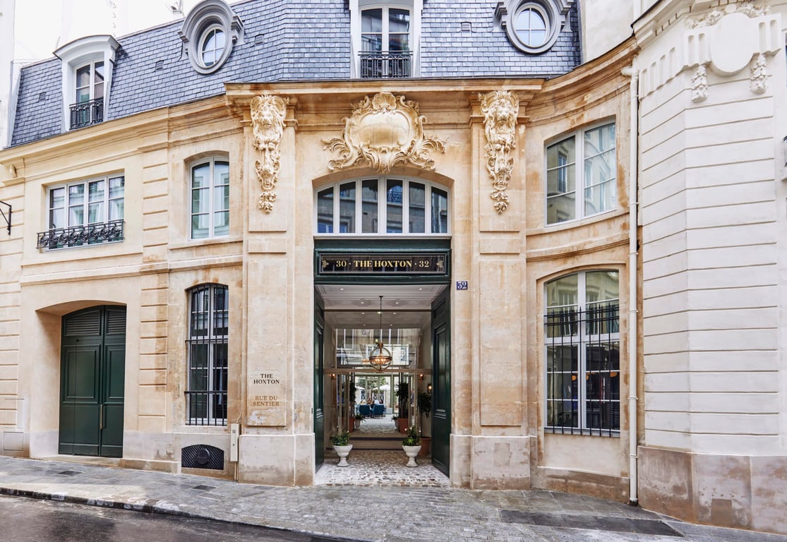 This Stylish Hotel Set Inside an 18th-Century Residence Honors Parisian History in a Cool, Contemporary Way | Original staircase houxton | Rivié | Bedroom Houxton