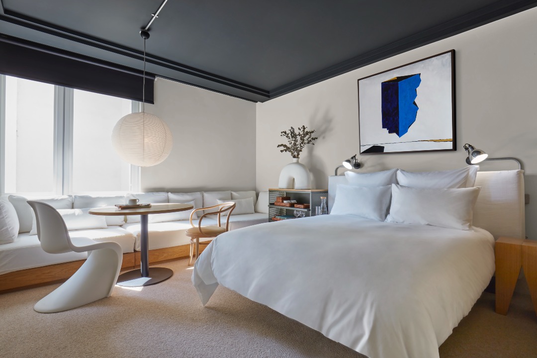 Discover Some of East London’s Hottest Spots Within This Hotel in Shoreditch | One Hundred Shoreditch bar | One Hundred Shoreditch evening on the balcony | One Hundred Shoreditch bedroom suite | One Hundred Shoreditch suite living room