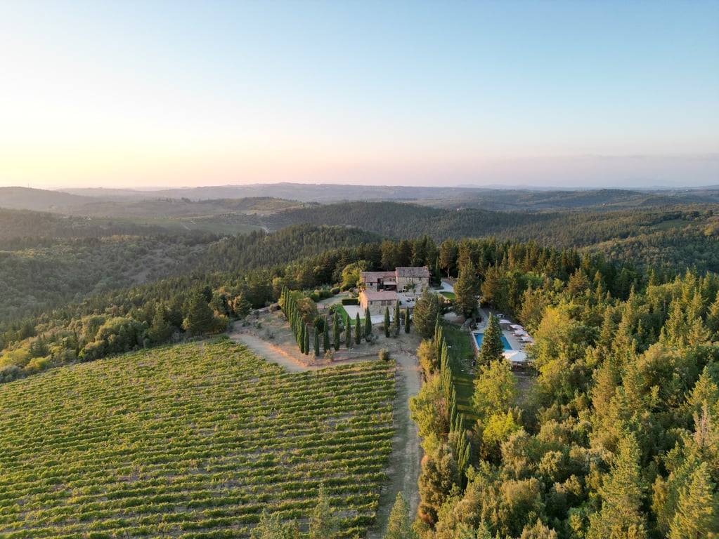 This Exclusive Tuscan Villa in Italy's Chianti Wine Region Embodies La Dolce Vita | Villa Ardore restaurant | Villa Ardore restaurant seating | Villa Ardore dinner table | Villa Ardore bedroom suite | Villa Ardore bedroom | Villa Ardore personal pizza | Villa Ardore outdoor pool | Villa Ardore spa