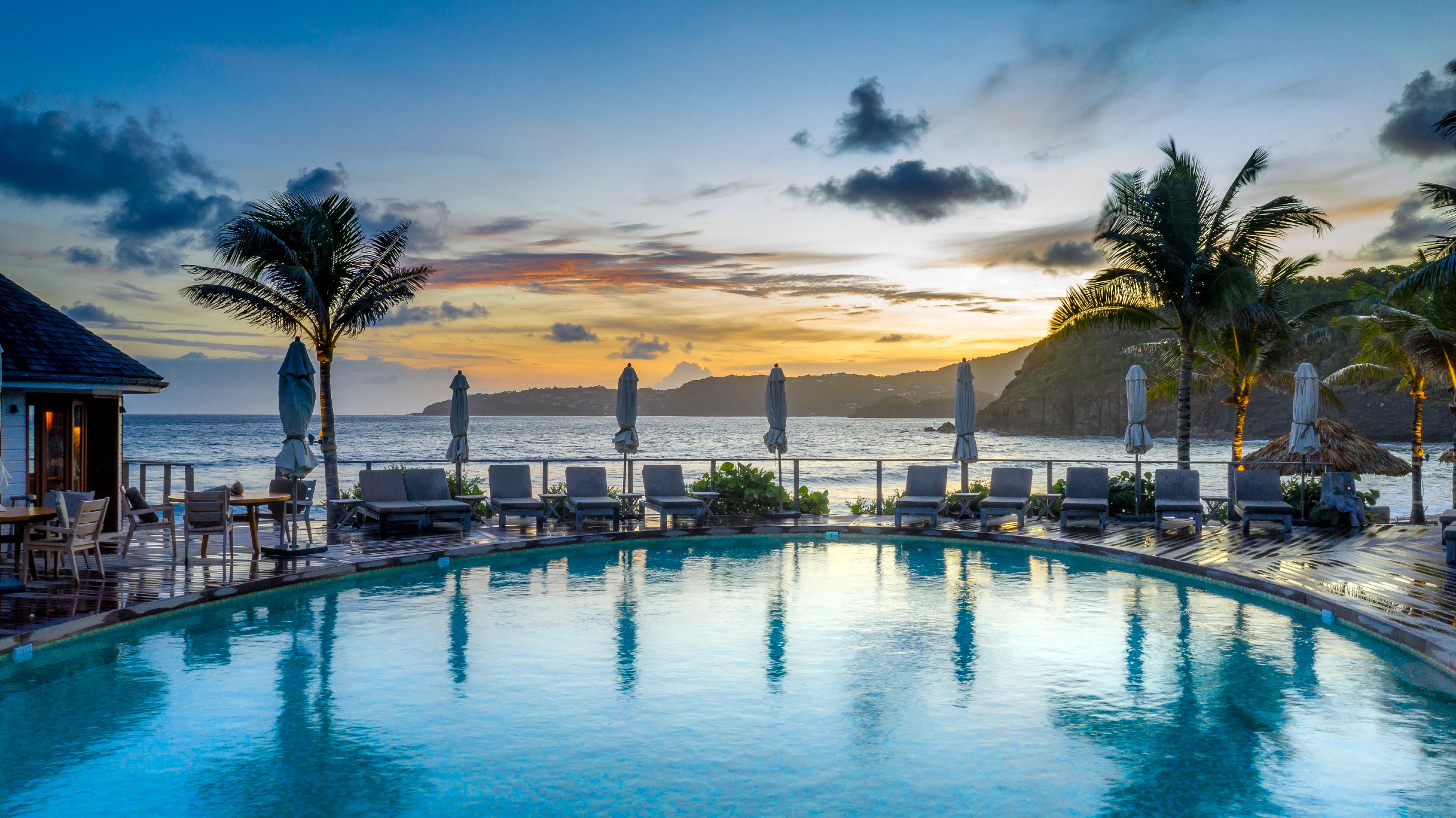 This Luxury Oceanfront Hotel in St Barth Redefines Relaxation | Hotel Manapany ocena view | Hotel Manapany suite living room | Hotel Manapany suite dining | Hotel Manapany outdoor pool | Hotel Manapany exterior | Hotel Manapany ocean entrance