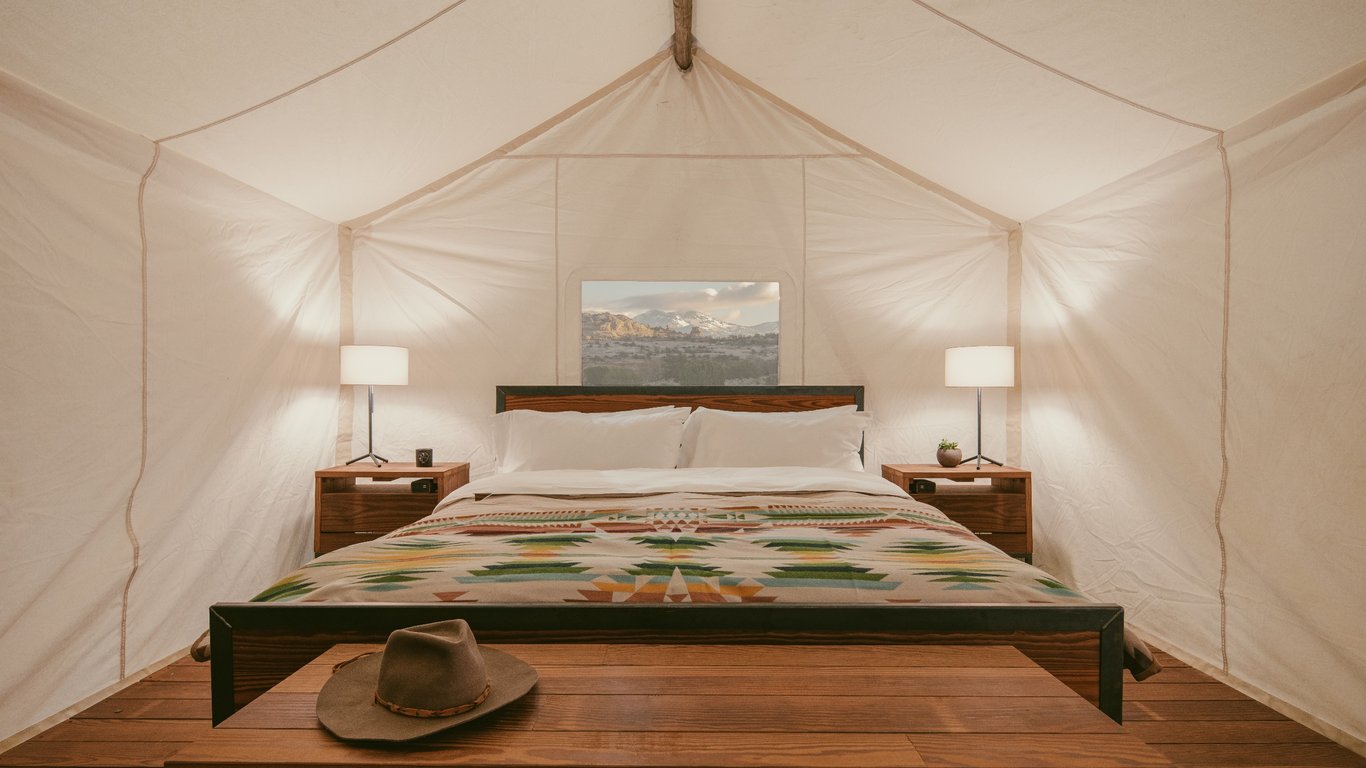 This Luxury Glamping Resort in Moab is the Perfect Elevated Outdoor Escape | ULUM communal hub fire pits | ULUM Glamping communal hub | ULUM Glamping aerial view | ULUM Glamping tent suite | ULUM Glamping yoga | ULUM Glamping restaurant