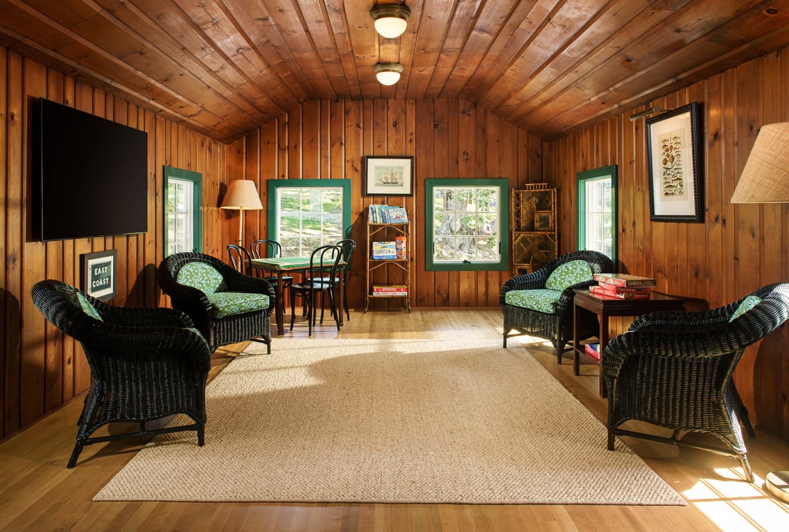 A Shelter Island Star Is (Re)born at The Pridwin Hotel and Cottages | The Pridwin entrance | The Pridwin lobby | The Pridwin book cases | The Pridwin exterior view | The Pridwin bedroom | The Pridwin bar seating | The Pridwin outdoor pool | The Pridwin game room | The Pridwin waterfront view
