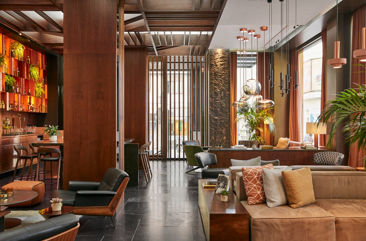 This Stylish Retreat Offers Modern Sophistication in the Heart of Spain’s Capital | Thompson Madrid rooftop pool | The Omar restaurant at Thompson Madrid | The rooftop lounge at Thompson Madrid | King Suite at Thompson Madrid