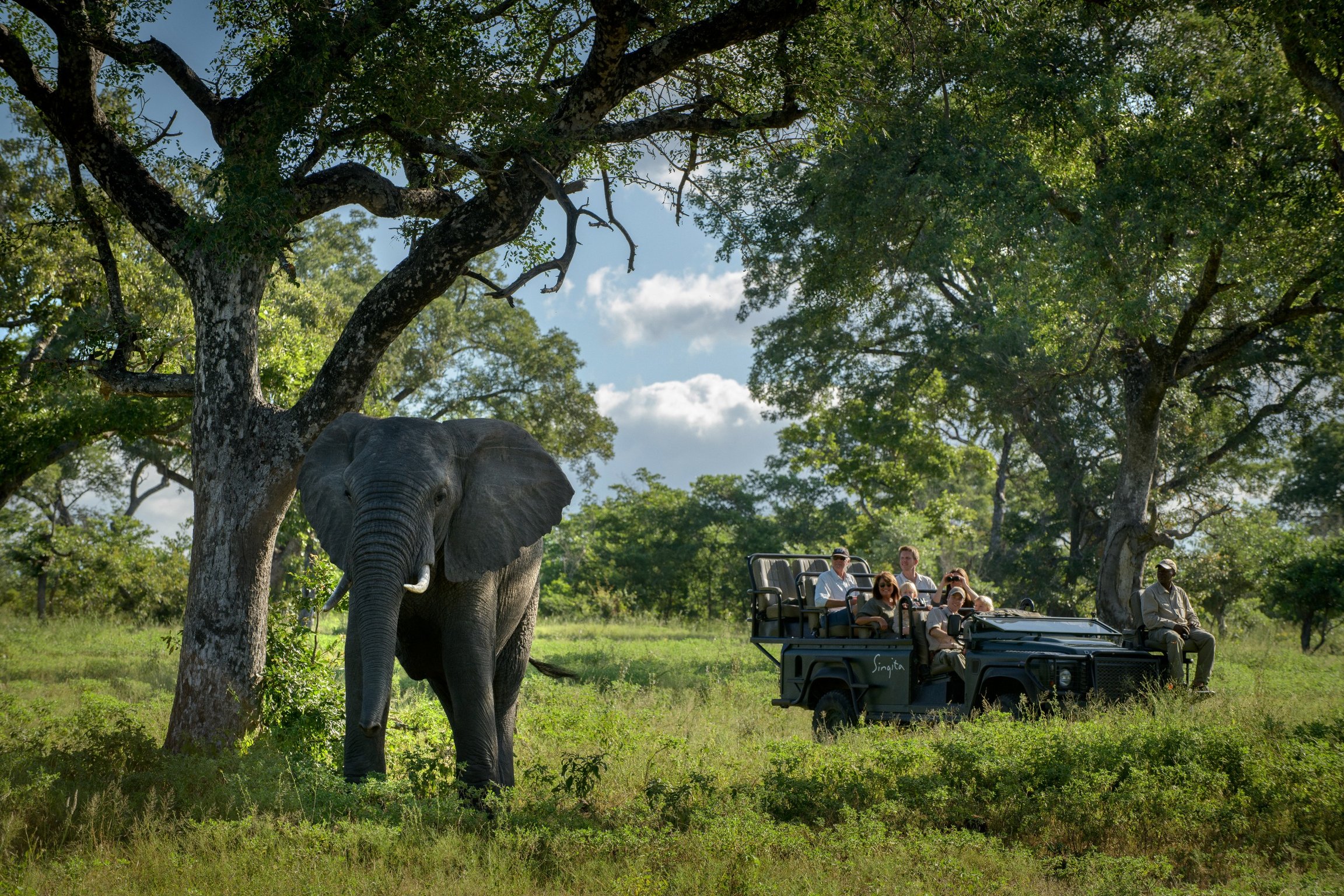 Experience Luxurious Conservation at South Africa's Premier Eco-Safari Retreat | Singita Boulders Lodge grounds | Singita Boulders Lodge suite | Singita Boulders Lodge courtyard | Singita Boulders Lodge outdoor tub | Singita Boulders Lodge safari truck | Singita Boulders Lodge food vendor | Singita Boulders Lodge trail