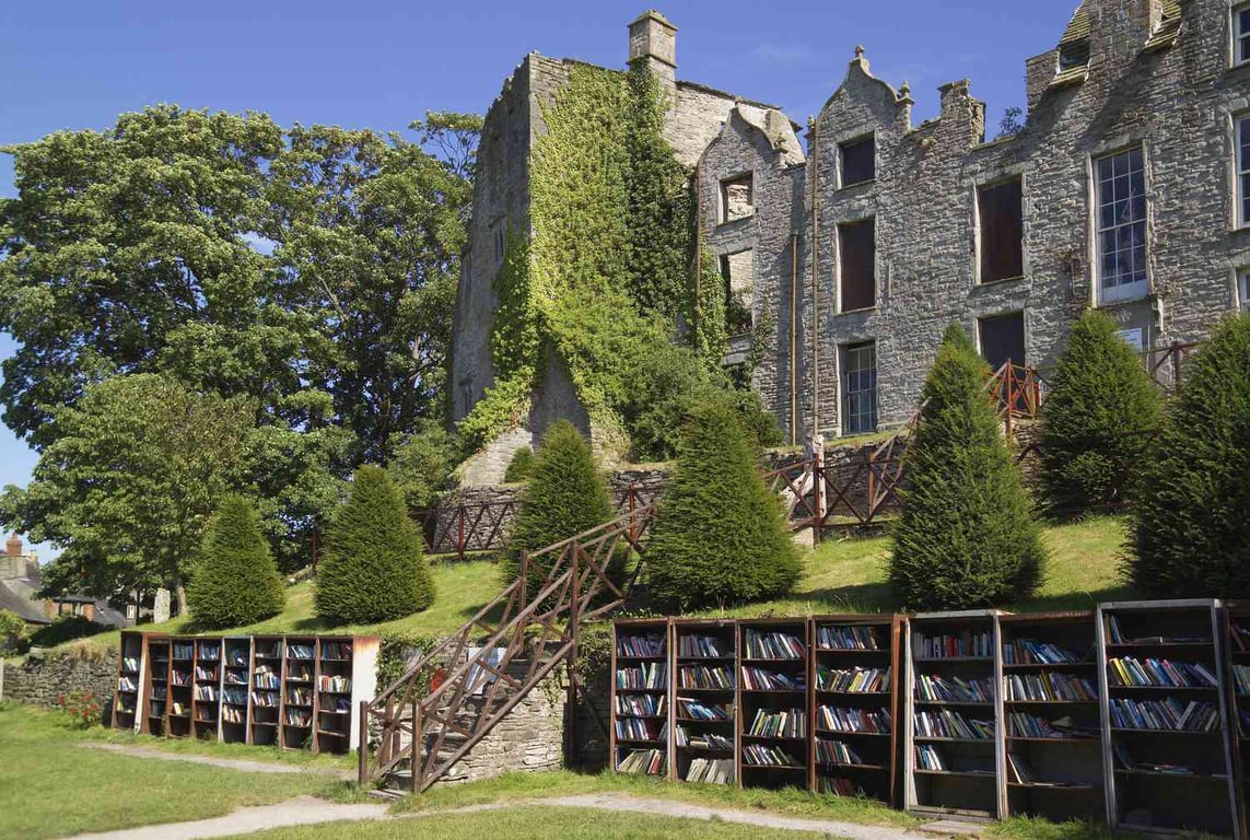 This Whimsical Town in Wales Is a Must-Visit for Bookworms | Book town wales house by Rachel O'Brien | Book town wales by Tim Pugh | Book town wales library | Book town wales castle library | Book town wales open air festival