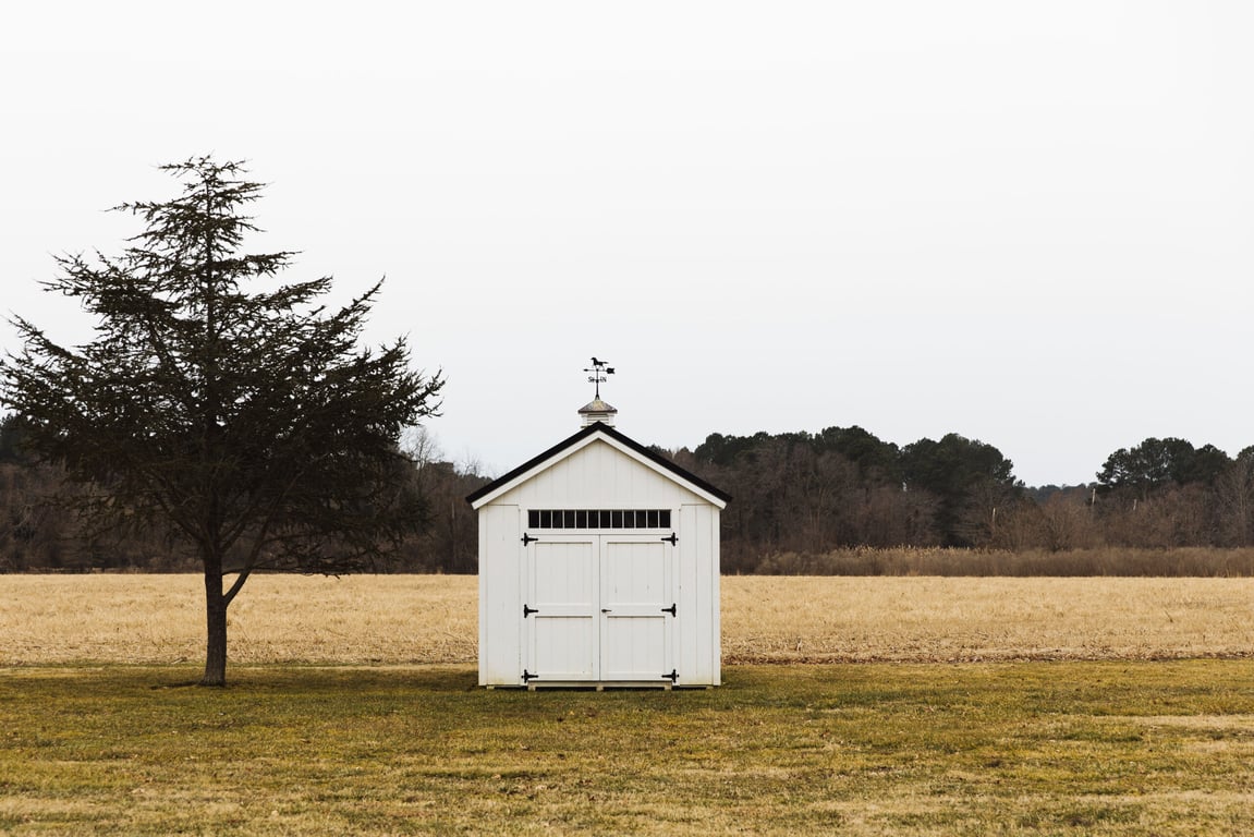 A Chic Country House Hotel on Maryland’s Charming Chesapeake Bay | The Wildset Hotel exterior | The Wildset Hotel bedroom | The Wildset Hotel restaurant | The Wildset Hotel bicycle | The Wildset Hotel boat dock | The Wildset Hotel table reservations