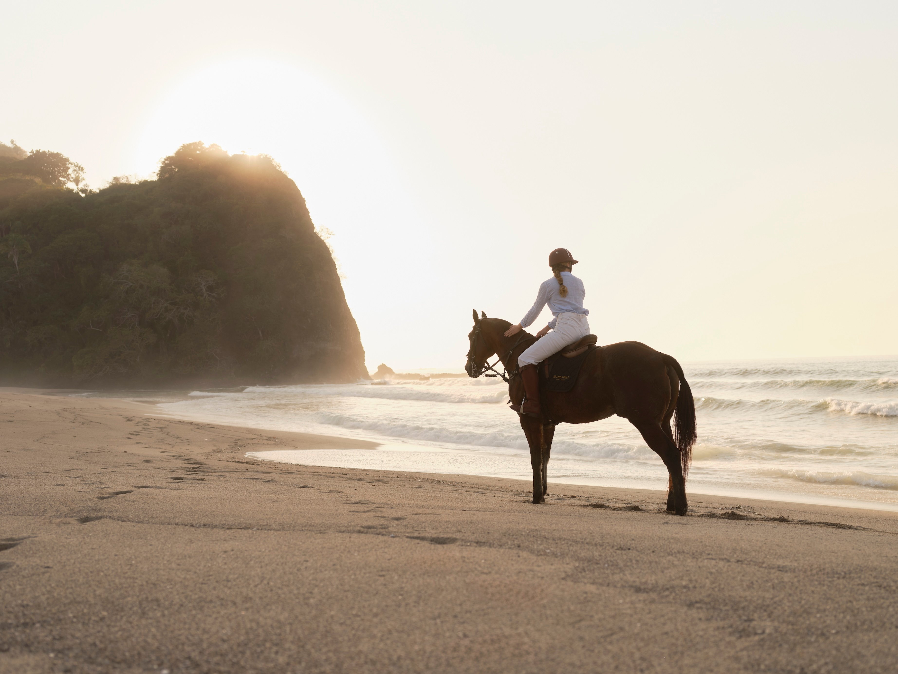 Horseback riding by the beach