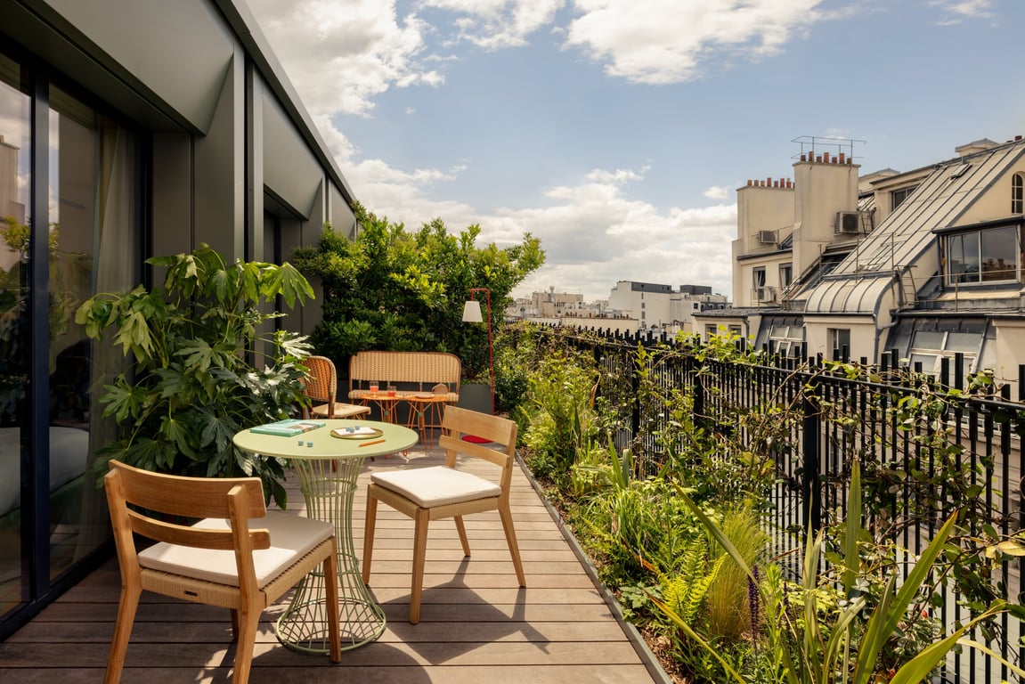 A Fantastical Stay and Secret Garden Await at This Boutique Hotel in Paris | La Fantaisie Paris suite seating and decor | La Fantaisie Paris golden poppy interior | La Fantaisie Paris junior suite with terrace | La Fantaisie Paris bar | La Fantaisie Paris la Cafe | La Fantaisie Paris spa