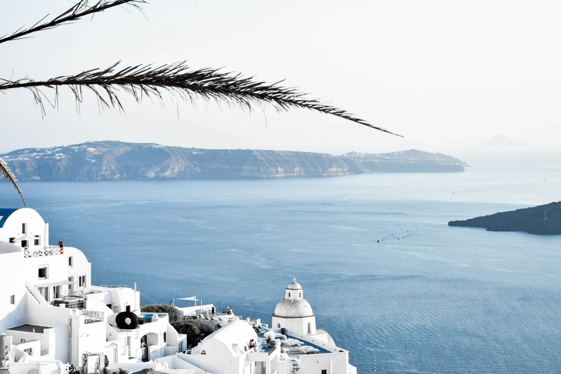 These Are the Top Travel Trends of 2024, According to Experts | Solo backpacker travelling in the desert | White-Lotus-Season-2-Filming-Location-Credit_-HBO-Max | Man waiting for flight in airport watching a plane take-off | Photograph-from-Taylor-Swifts-performance-in-Sao-Paulo-Brazil | Taj-Lake-Palace-Udaipur | Business people walking in an airport with suitcases