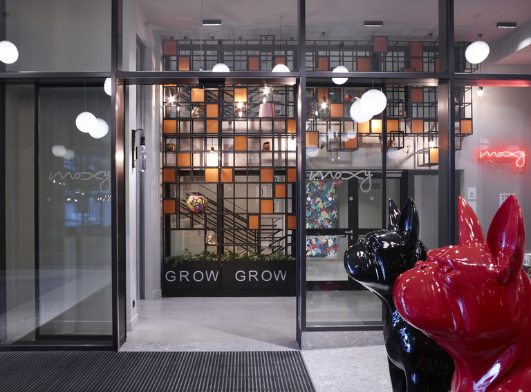 This Athens Hotel Is Ushering In A Stay For The Modern Traveler | Moxy Athens seating | Moxy Athens bar | Moxy Athens suite | Moxy Athens bedroom